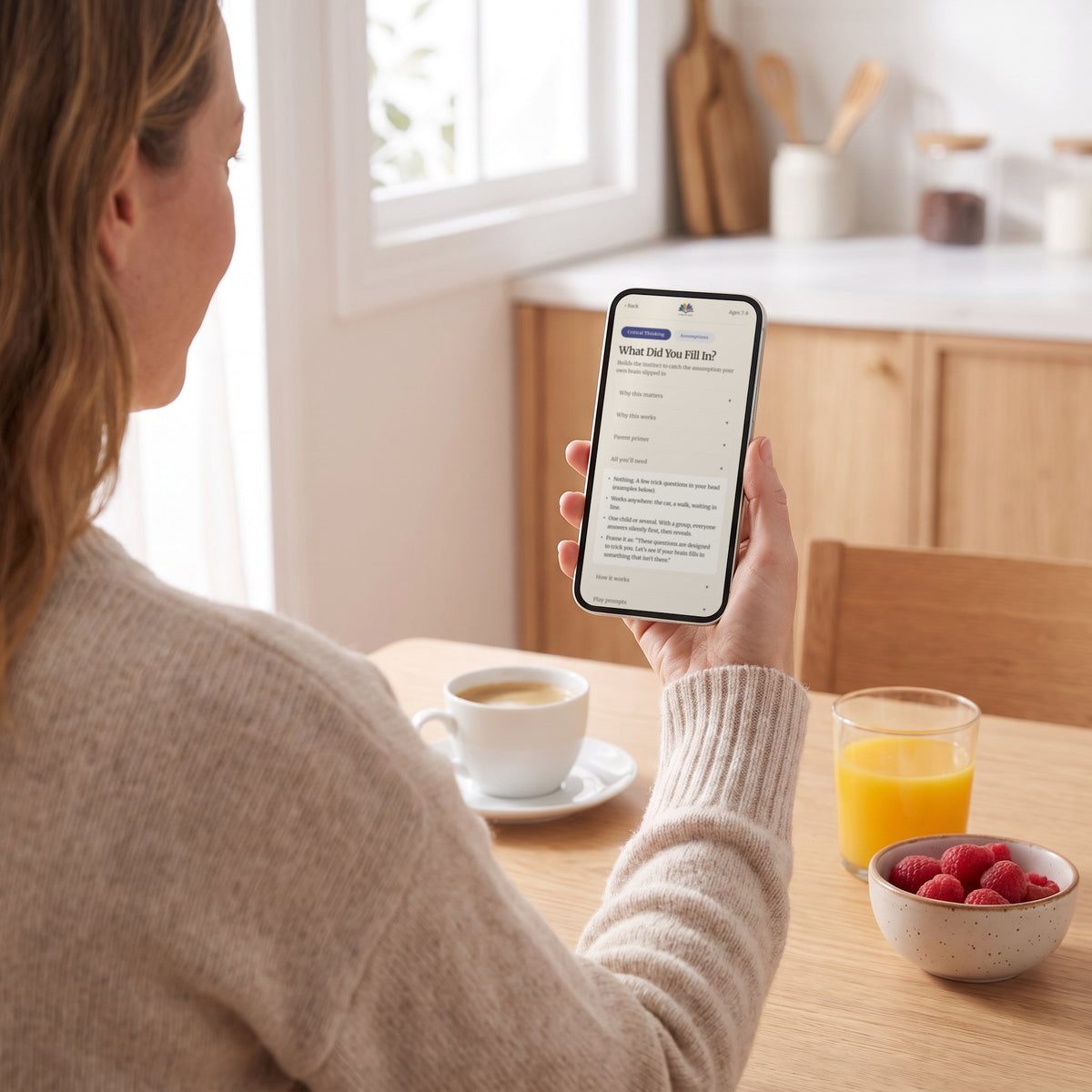 A mother reading the What Did You Fill In? activity on her phone at the kitchen table before playing
